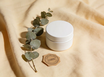 Certified-organic clean beauty — eucalyptus and an unbranded jar